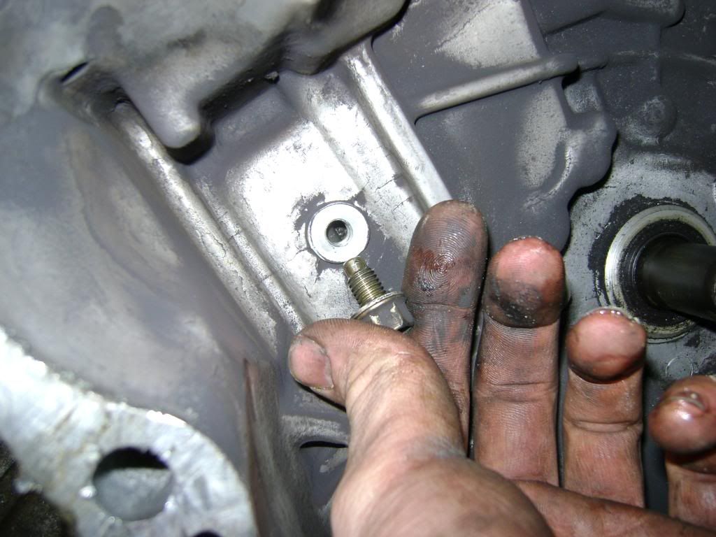 remove the (8.) 14 mm bolts as shown and remove cover by hitting it with  the plastic hammer or rubber mallet or your palm