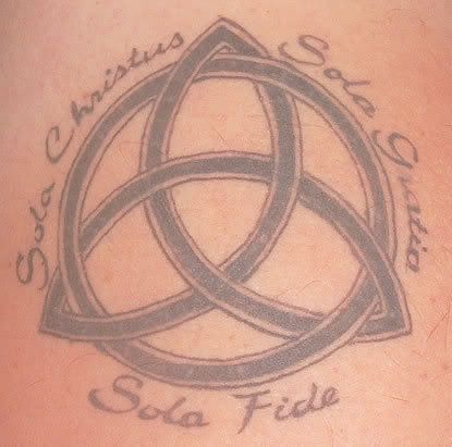 Celtic tattoo of the "triquetra symbol", also known as the Celtic triangle.